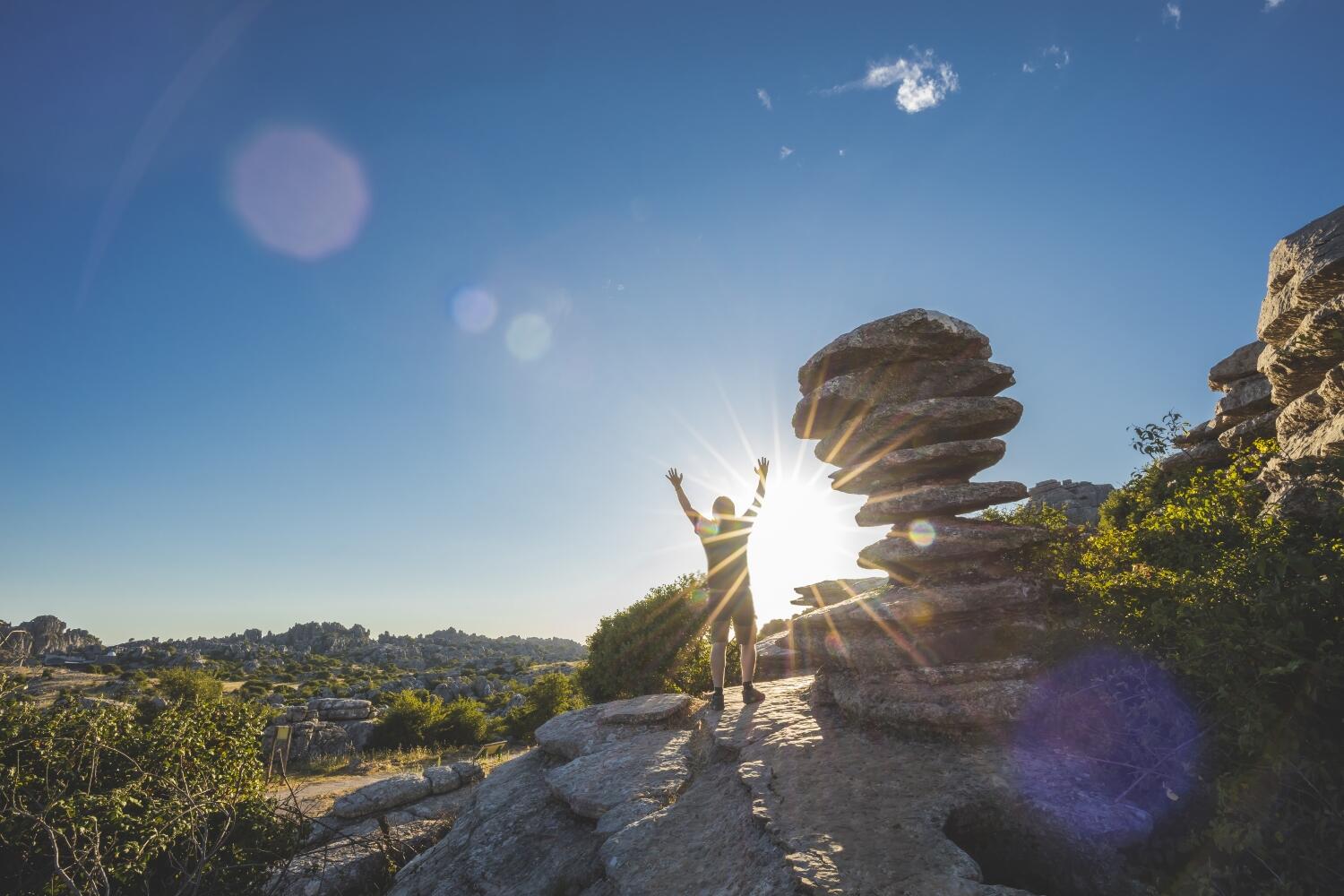 Adventurous man standing on a mountain