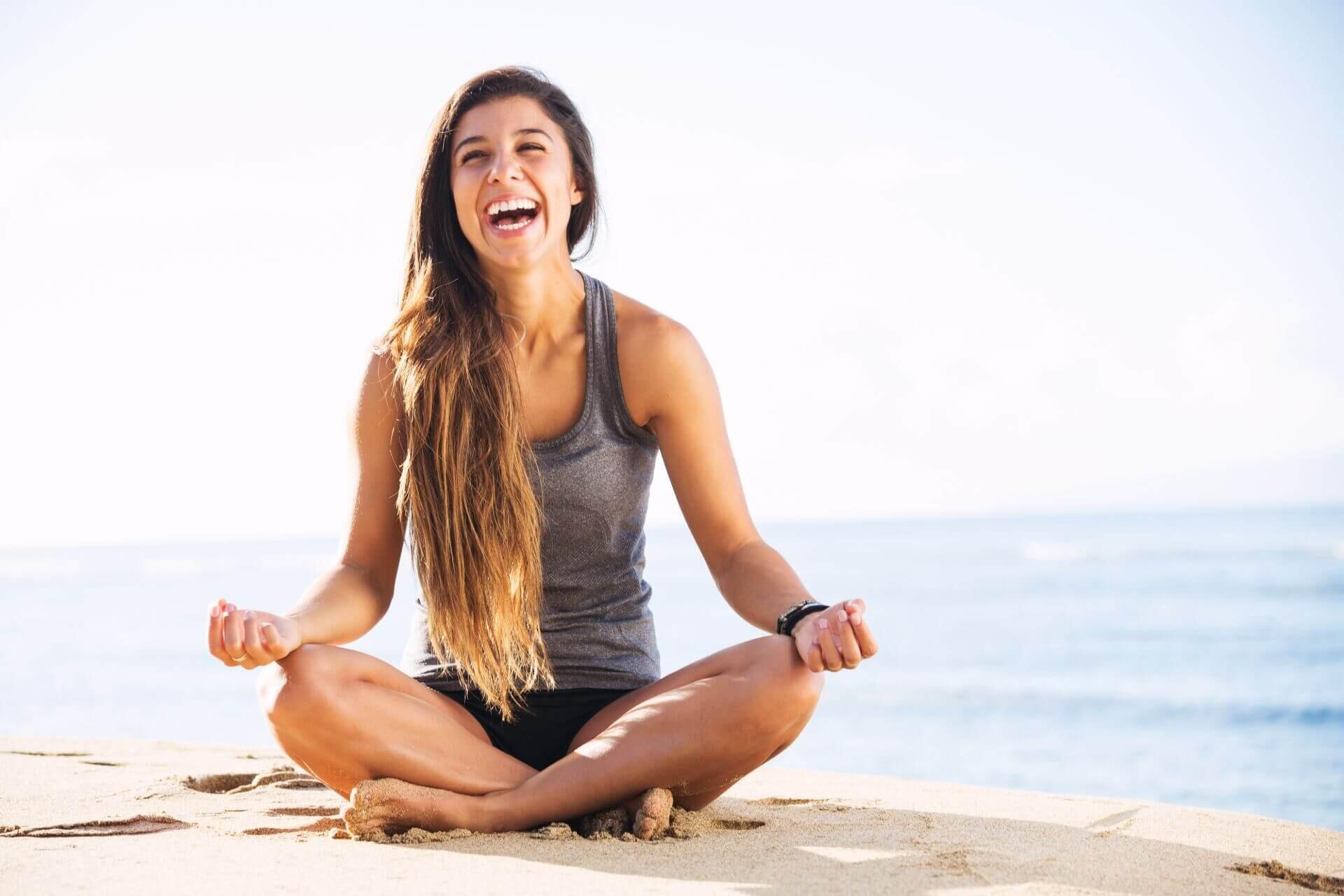 smiling woman by the beach meditation concept smiling woman by the beach meditation concept