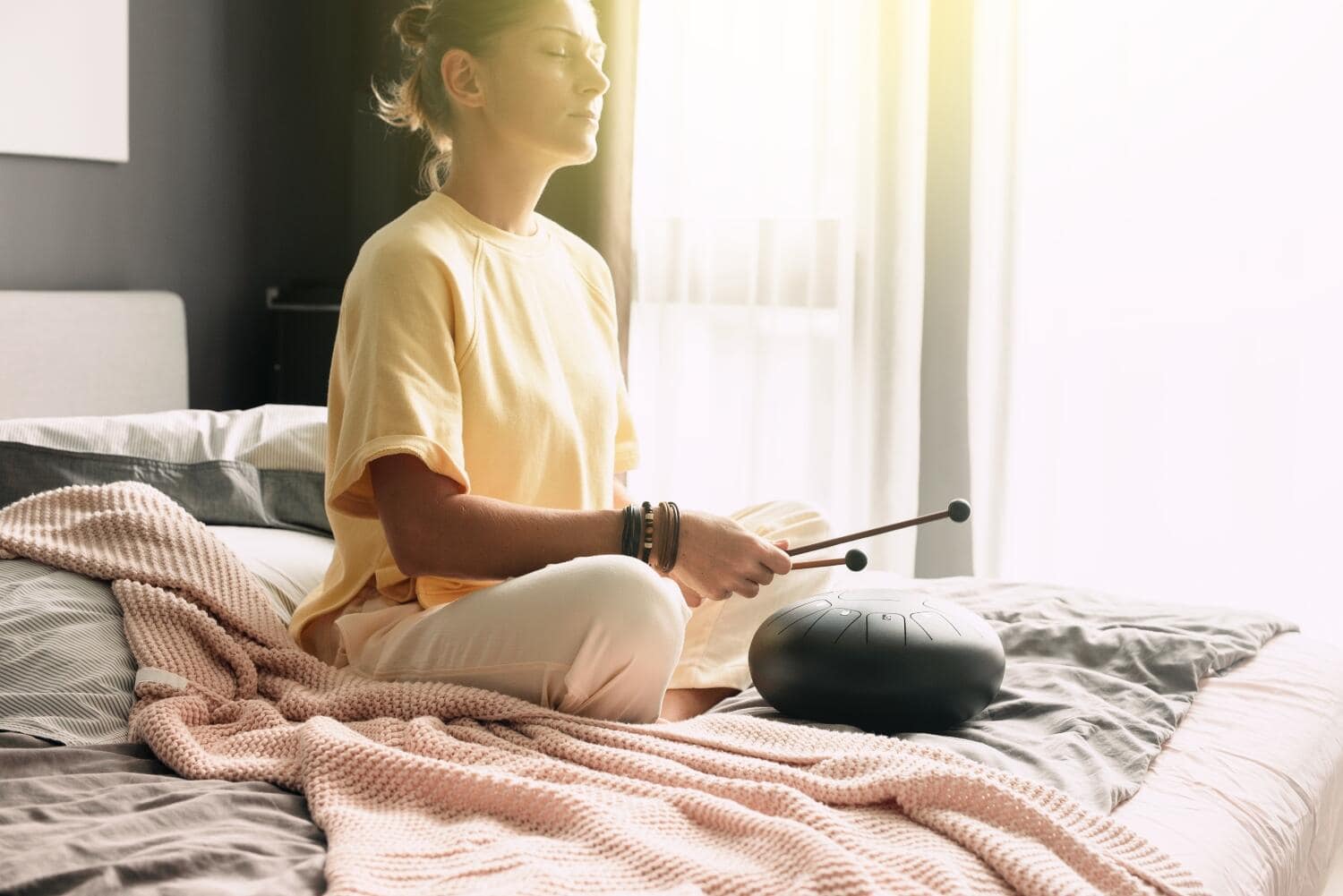 Mental health mindfullness wellbeing and balance concept. Sounds therapy. Women health. Tank drum Mental health mindfullness wellbeing and balance concept. Sounds therapy. Women health. Tank drum