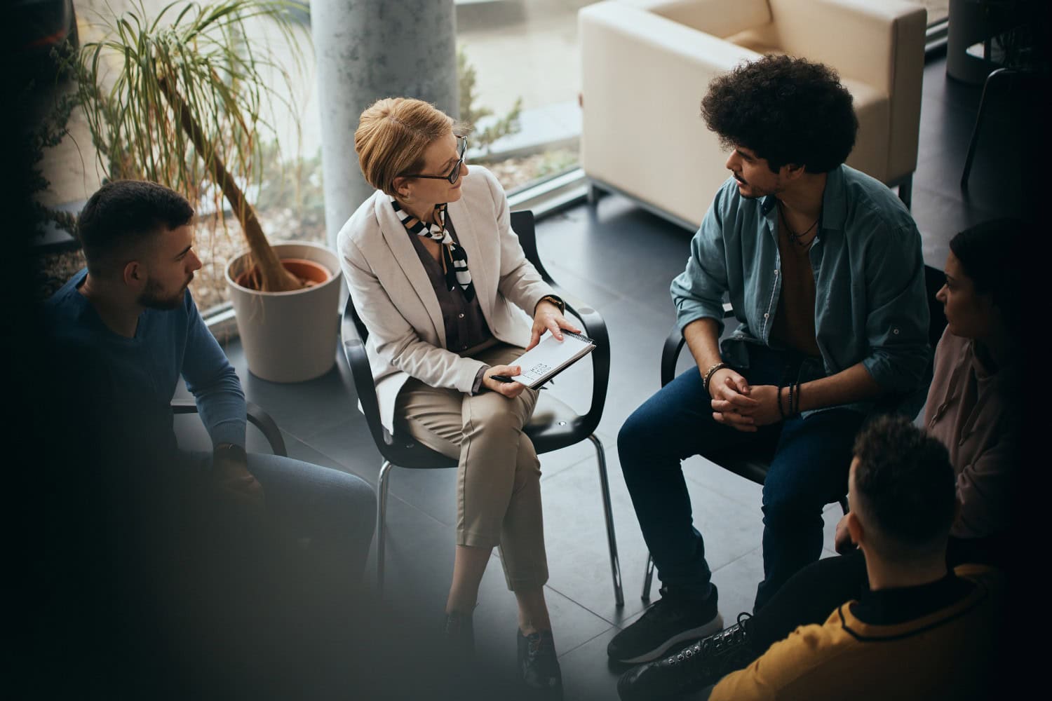 Above view of counseling during group therapy