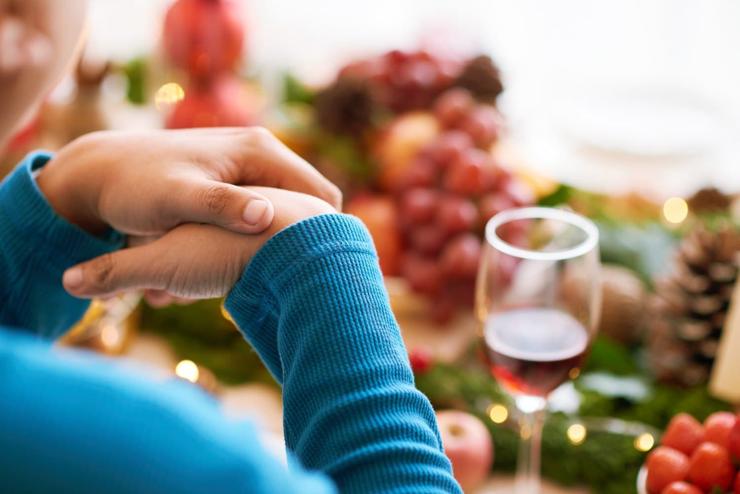 blurred image of an alcoholic drink on a christmas dinner table