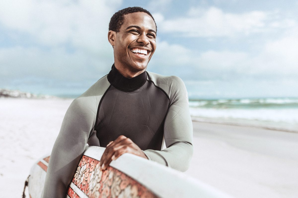 Surfer at the beach summer vacation, vivid tone